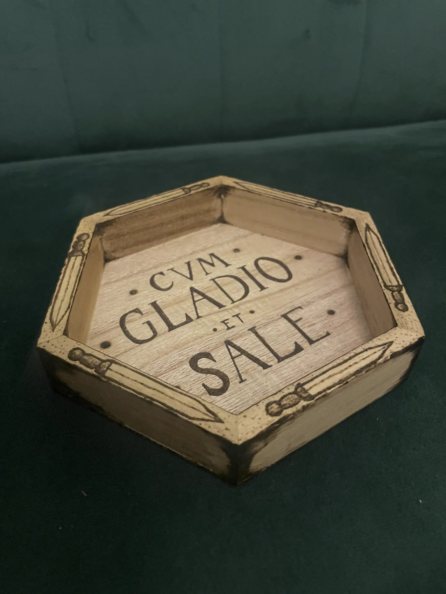 Hexagonal dice tray burned with daggers and the words Cum Gladio et Sale